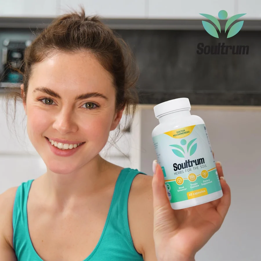 A woman holding the Soultrum bottle in a bright kitchen