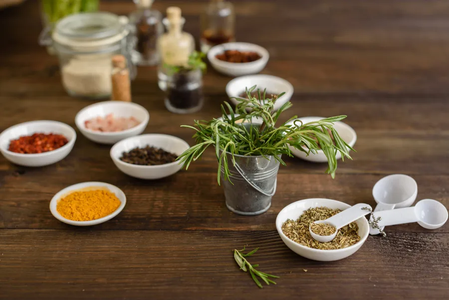 Herbs, spices and turmeric on a wooden table